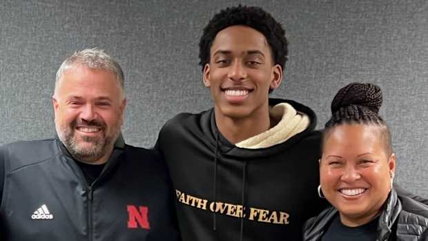 Dawson Merritt with his mother and Nebraska head coach Matt Rhule
